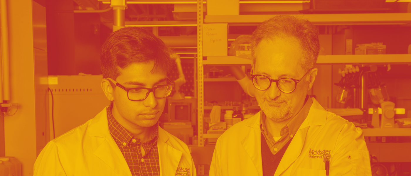 Rashik Ahmed, PhD candidate in the Department of Biochemistry and Biomedical Sciences and Giuseppe Melacini, professor in the Departments of Chemistry and Chemical Biology in lab inside ABB, standing in front of computer